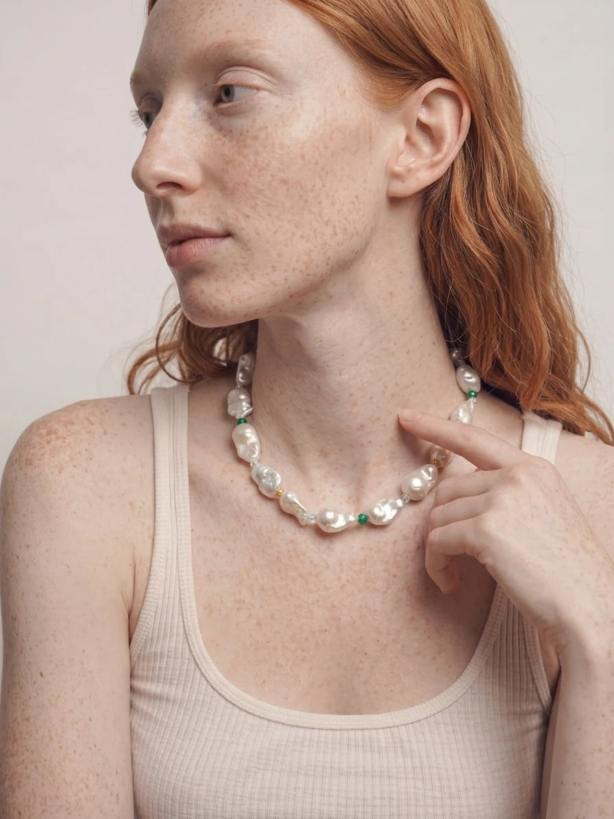 Model wearing The Story I Wear baroque pearl and gemstone necklace
