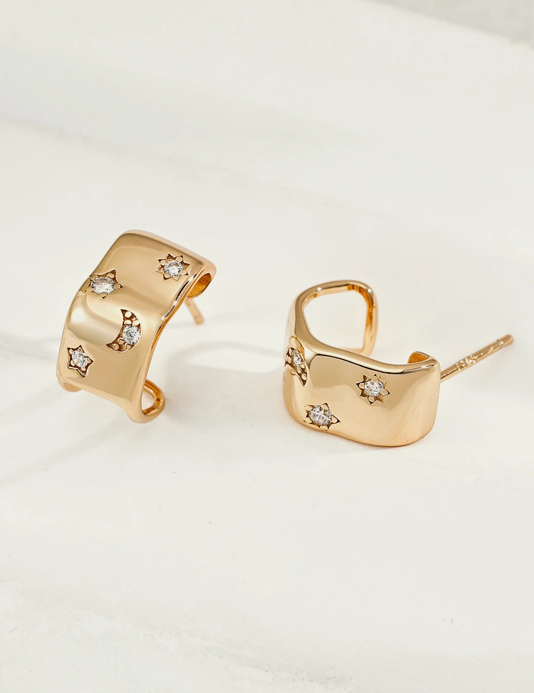 Celestial Star & Moon Huggie Earrings in gold, 18K gold-plated 925 sterling silver with cubic zirconia stars and moon
