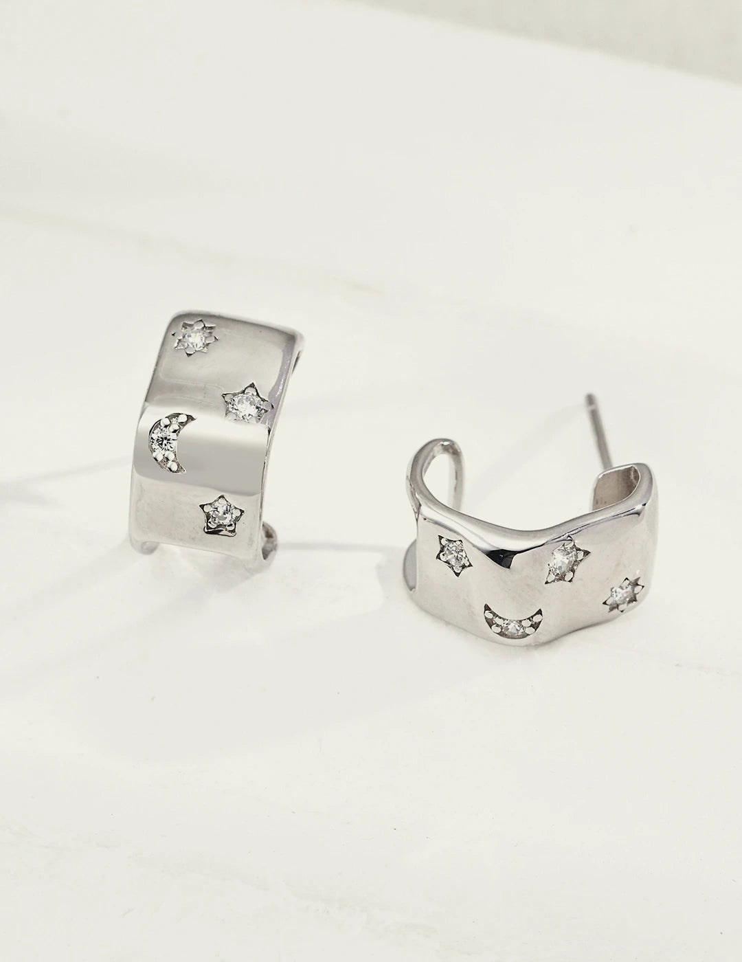 Celestial Star & Moon Huggie Earrings in silver, 925 sterling silver with cubic zirconia stars and moon