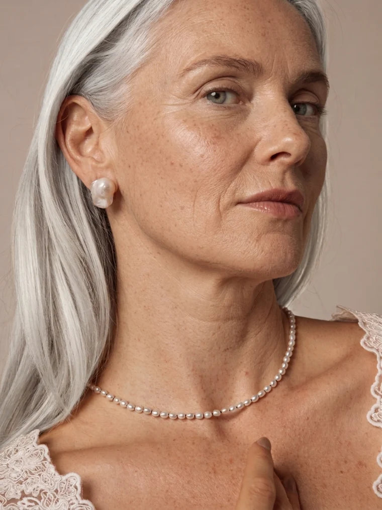 Natural freshwater seed pearl necklace shown on model