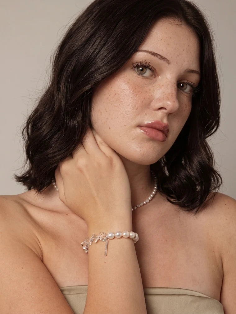 Model wearing the freshwater pearl and clear quartz bracelet