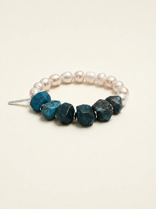 Freshwater pearl and blue apatite beaded bracelet on warm ivory background