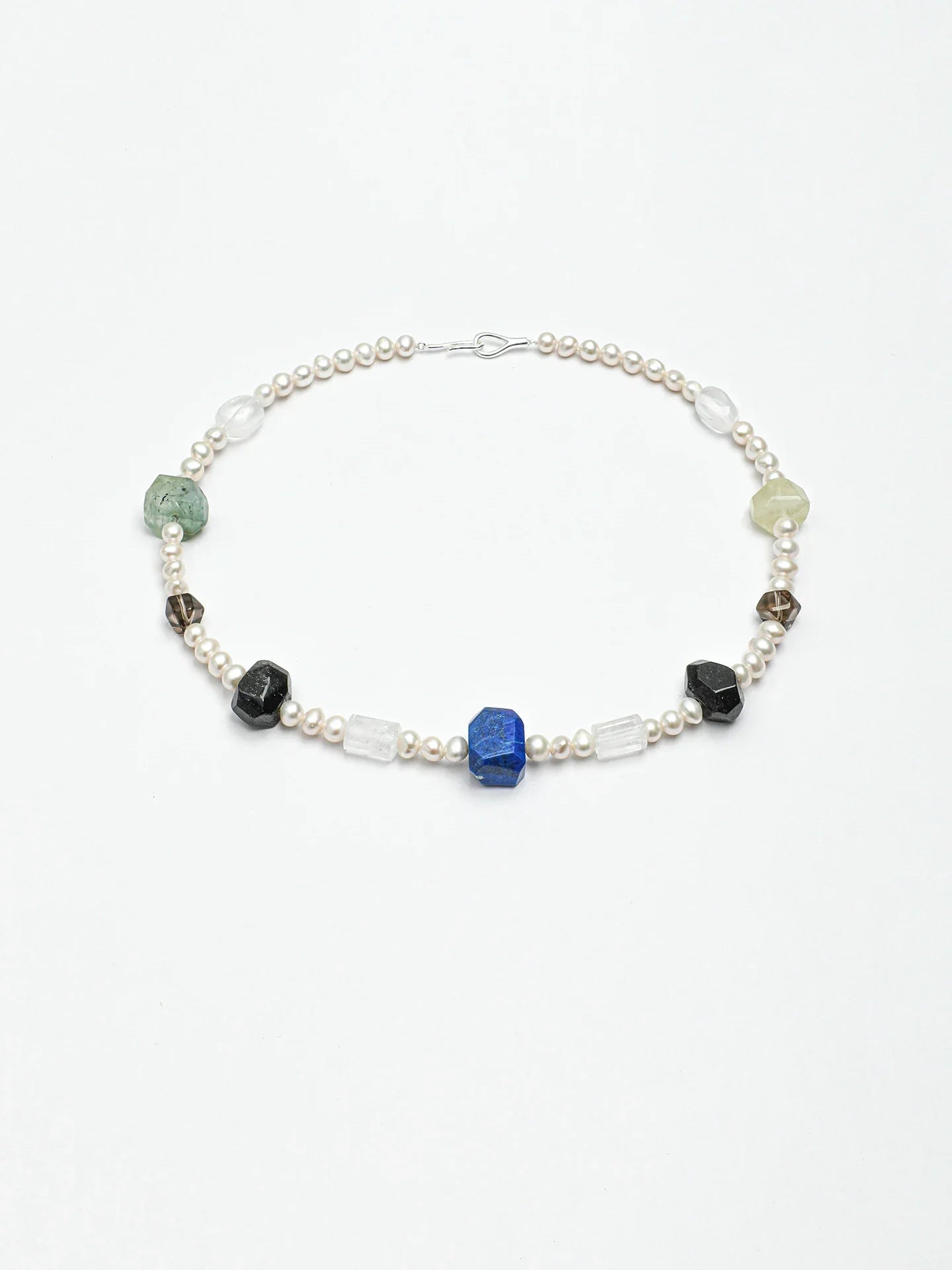 Model styling pearl earrings with a natural gemstone pearl necklace; earrings are not included