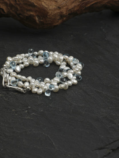 Coiled pearl and blue topaz necklace showing the silver clasp and bead details