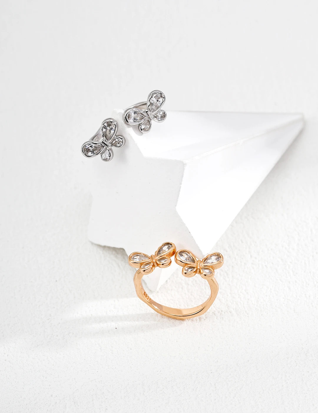 Butterfly Bloom Crystal Open Ring in gold and silver shown together
