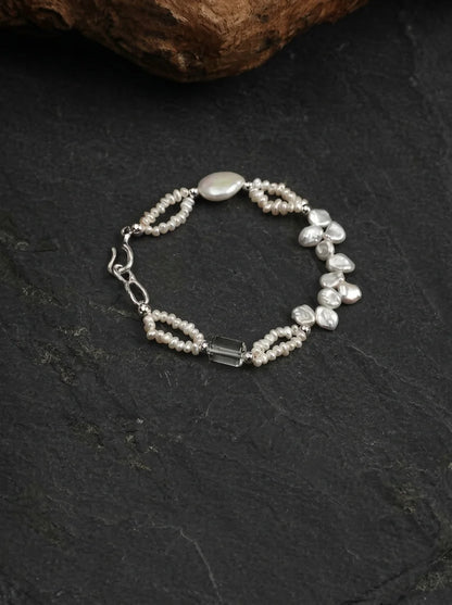 Crashing Waves bracelet showing layered baroque pearls and clear quartz columns