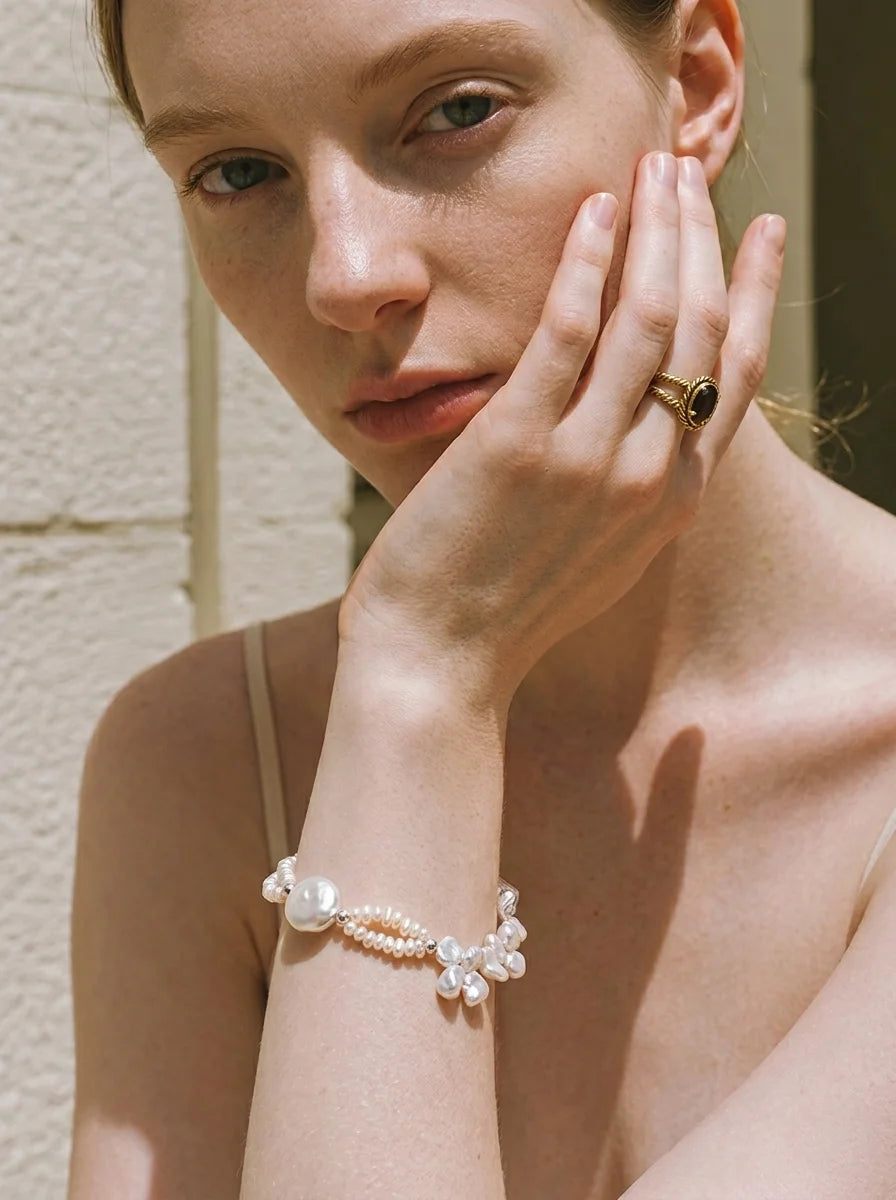 Illustrative styling image of the Crashing Waves bracelet worn on the wrist