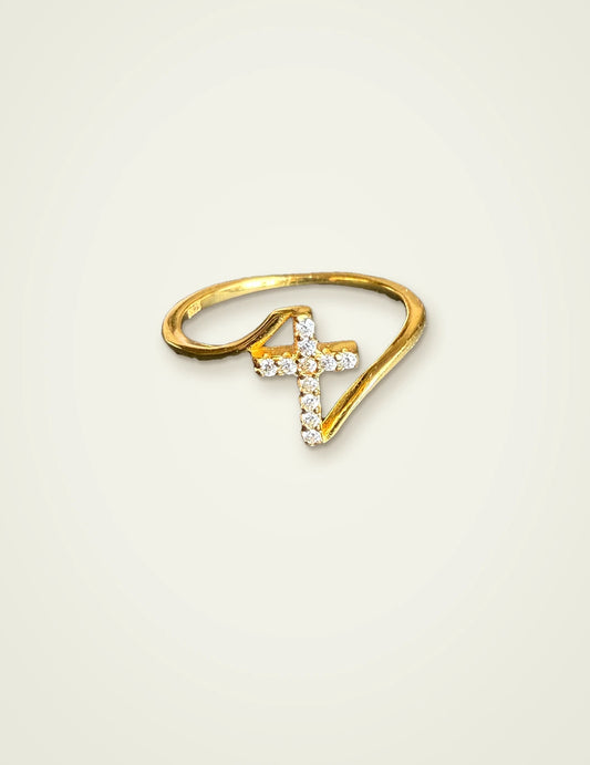 Dainty cross ring in 14K gold plated 925 sterling silver with CZ stones on a cream background