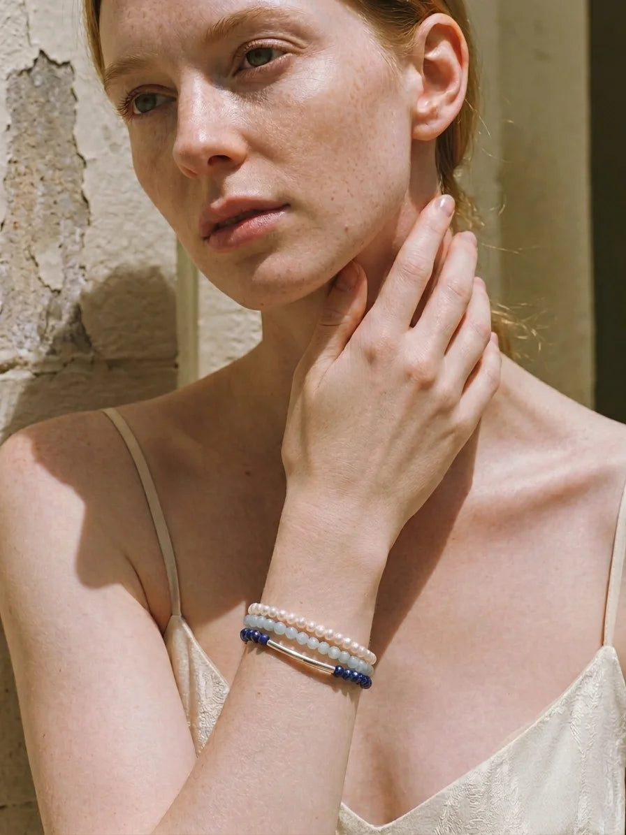 Illustrative styling image of the Deep Sea Tide bracelet set worn on the wrist