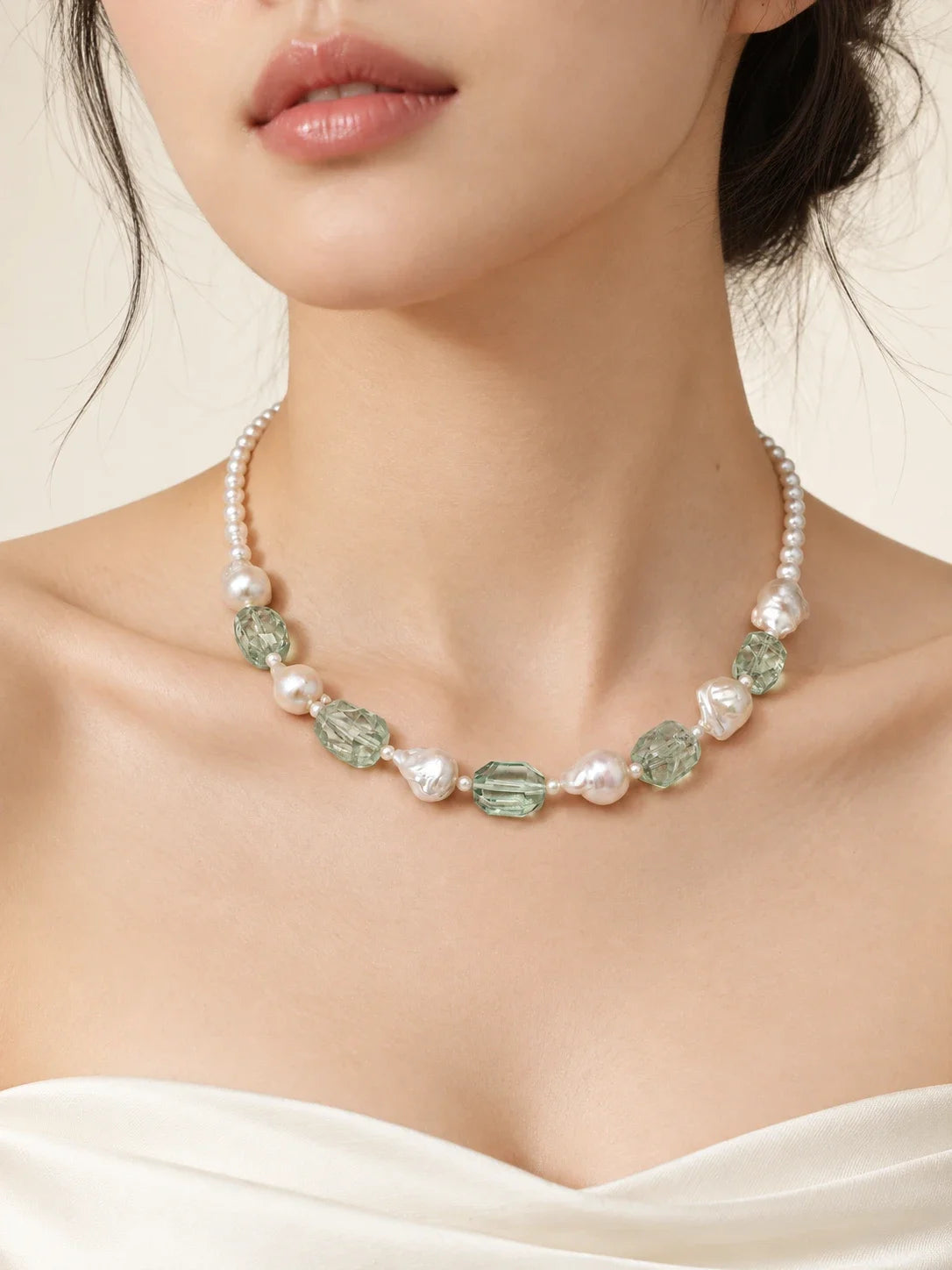 Model wearing the Forest Dew baroque pearl and green quartz necklace