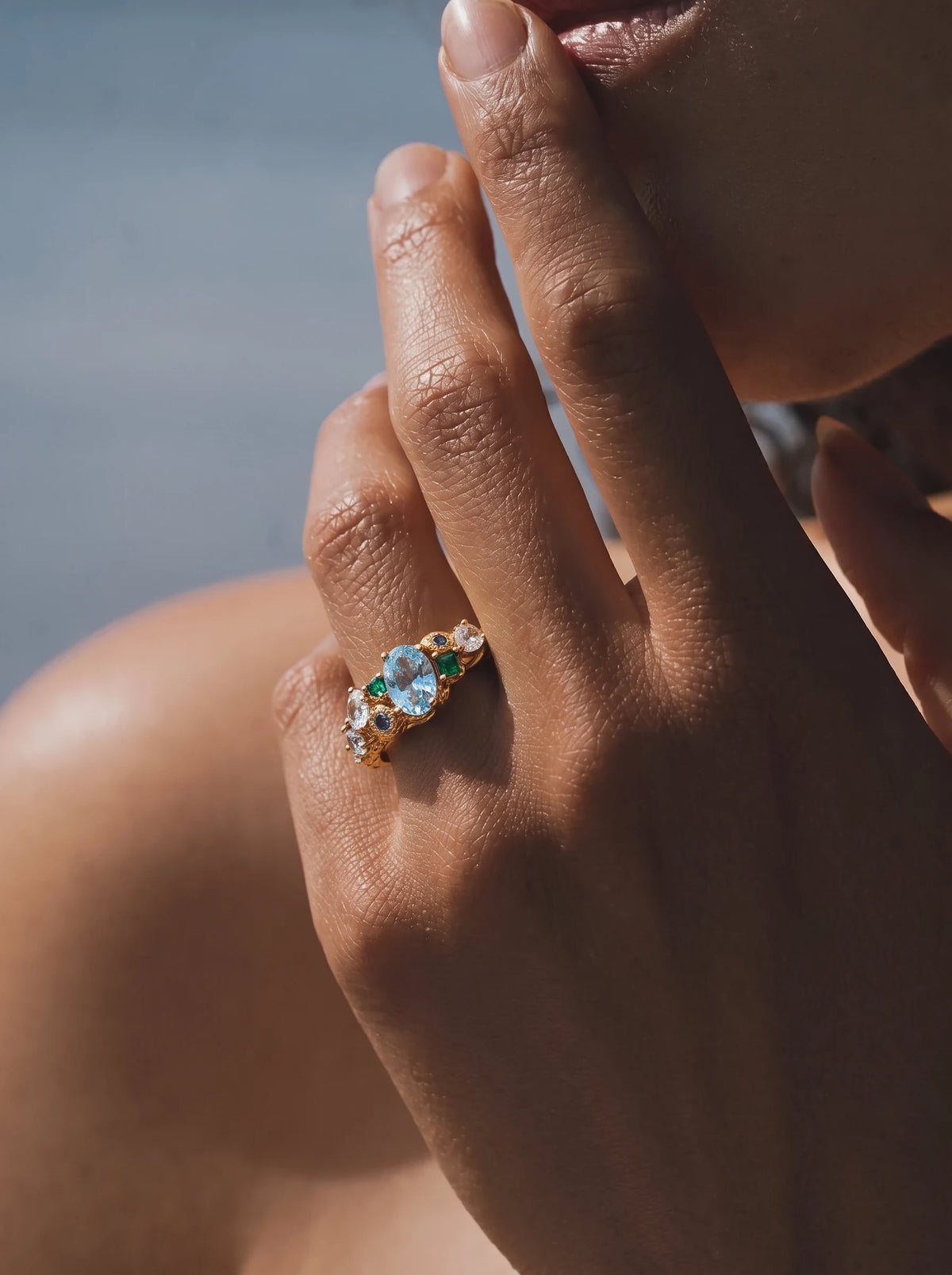 Close-up of a model wearing the Forest Heartbeat Open Ring in warm sunlight