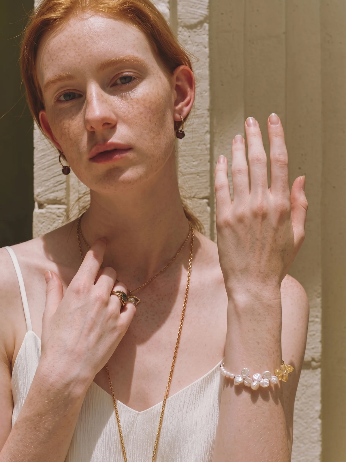 Illustrative styling image of the Golden Bloom bracelet worn on the wrist