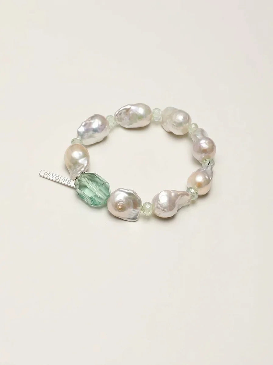 Psyours Misty Green baroque pearl and prehnite bracelet, flat lay on cream background
