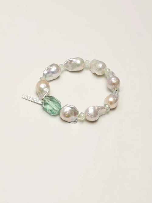 Psyours Misty Green baroque pearl and prehnite bracelet, flat lay on cream background