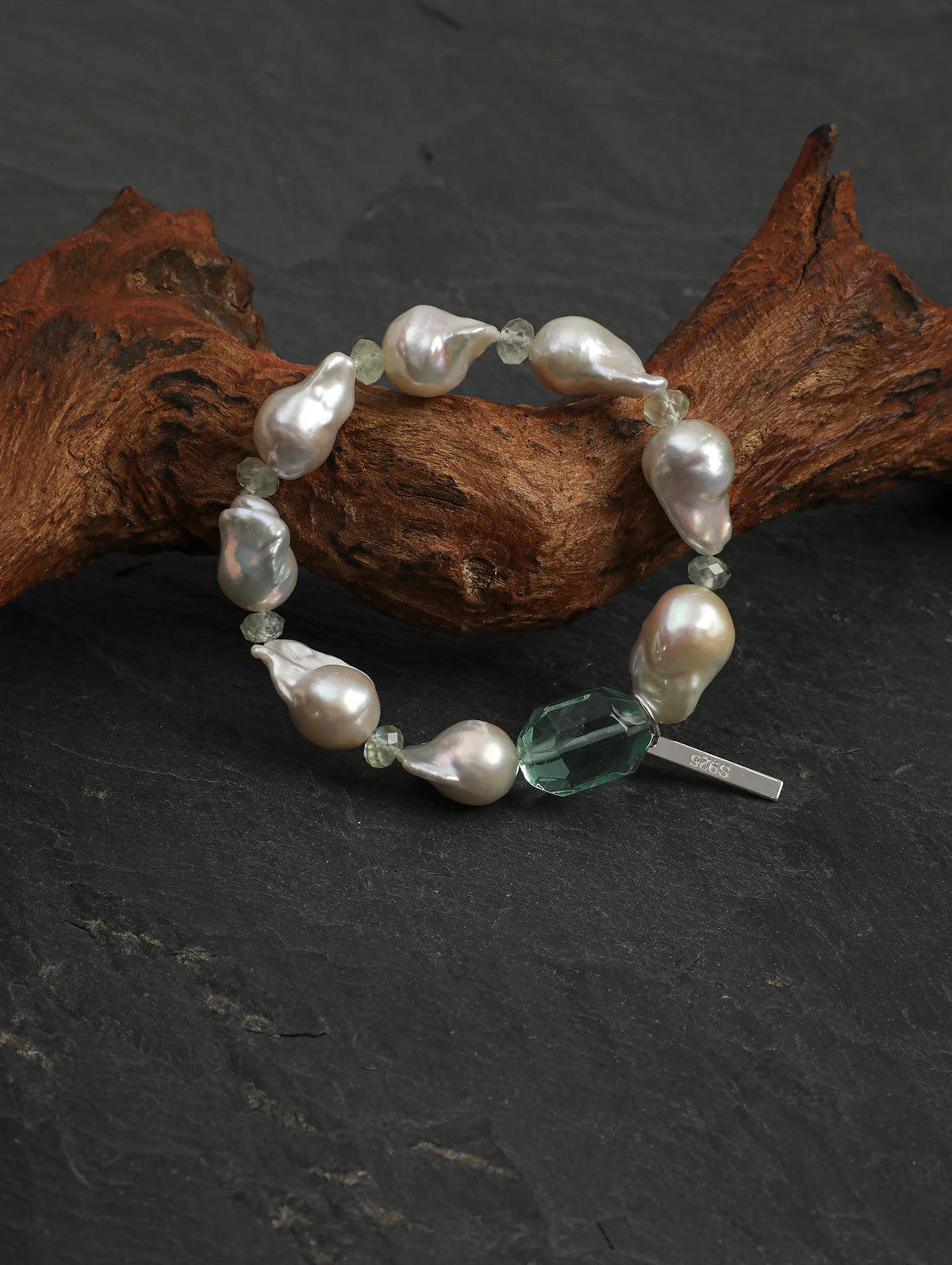 Psyours Misty Green bracelet on dark slate with driftwood