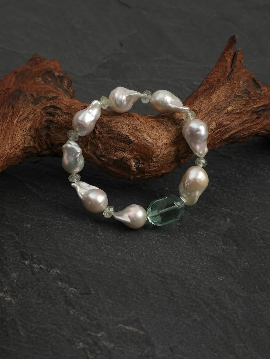 Close-up detail of baroque pearls and prehnite beads on the Psyours Misty Green bracelet