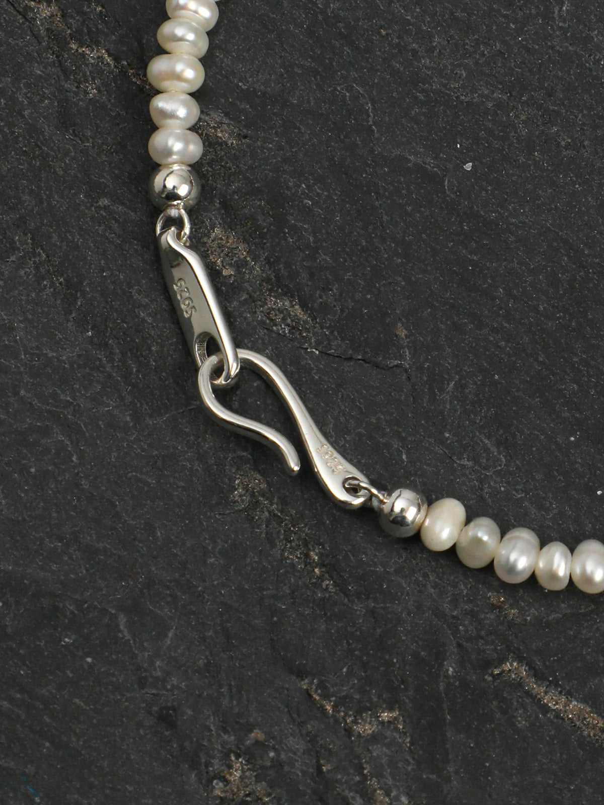 Close-up of the S925 sterling silver hook clasp on the Ocean Tears bracelet