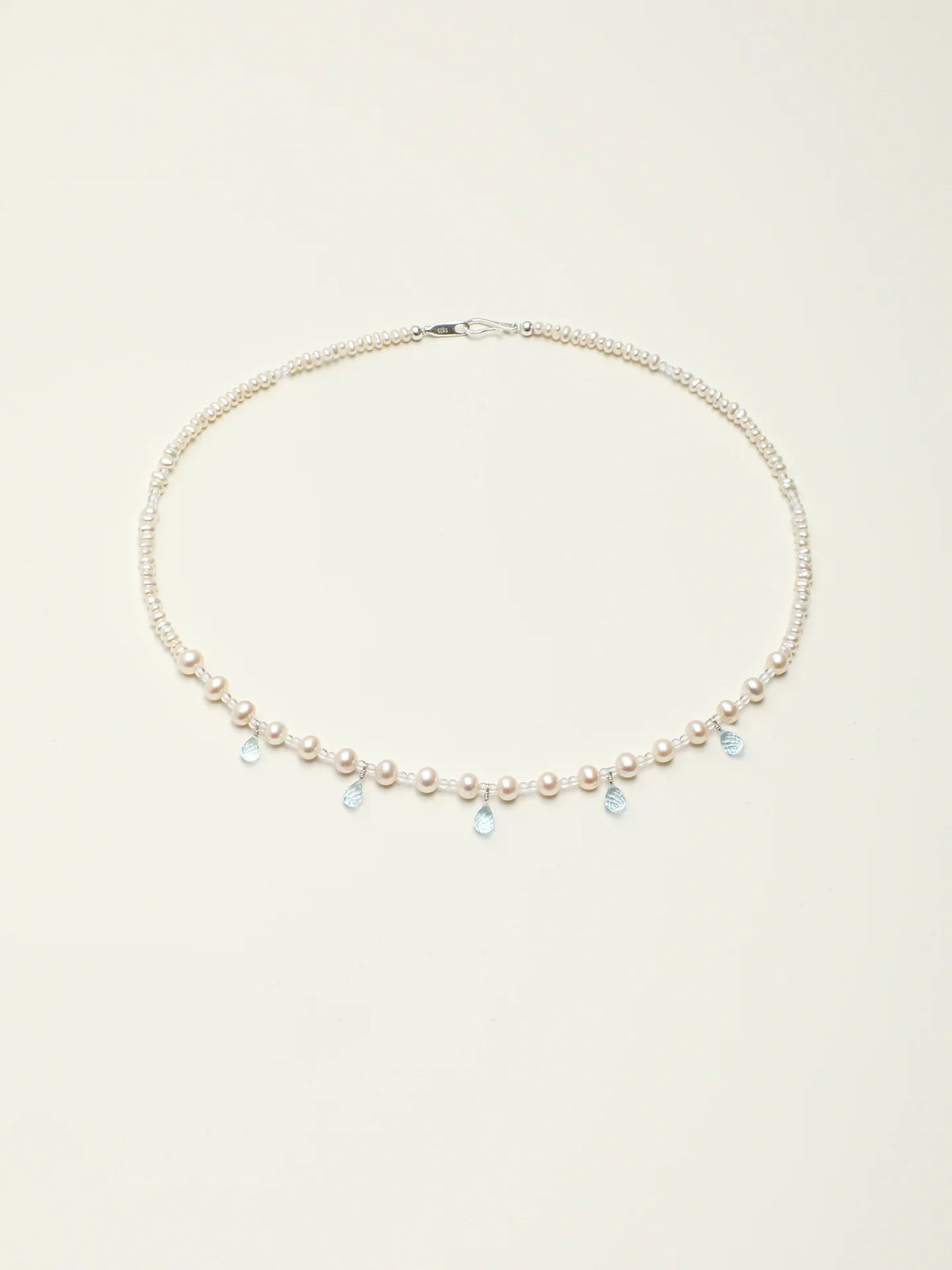 Full-length view of the Ocean Tears pearl and blue topaz necklace