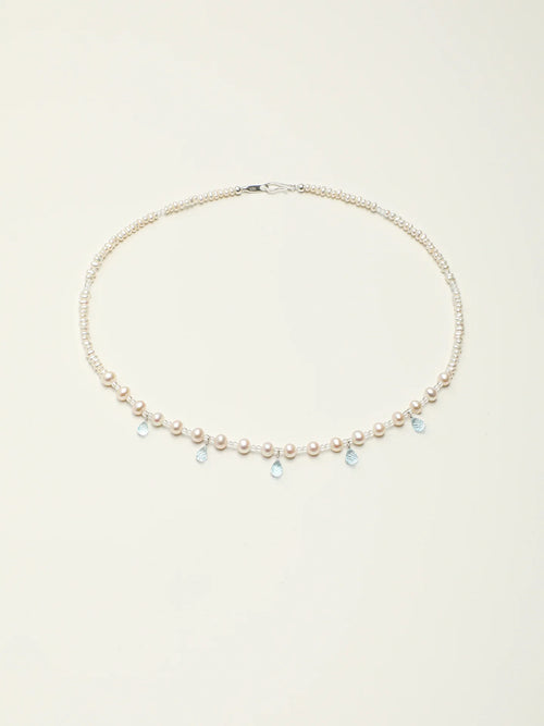 Full-length view of the Ocean Tears pearl and blue topaz necklace