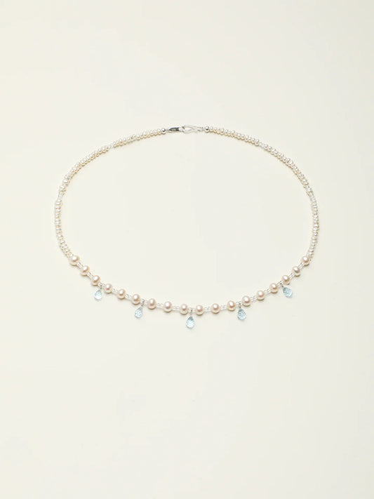 Full-length view of the Ocean Tears pearl and blue topaz necklace