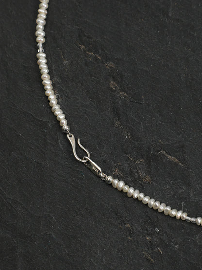 Close-up of the dangling blue topaz teardrops and clear quartz beads