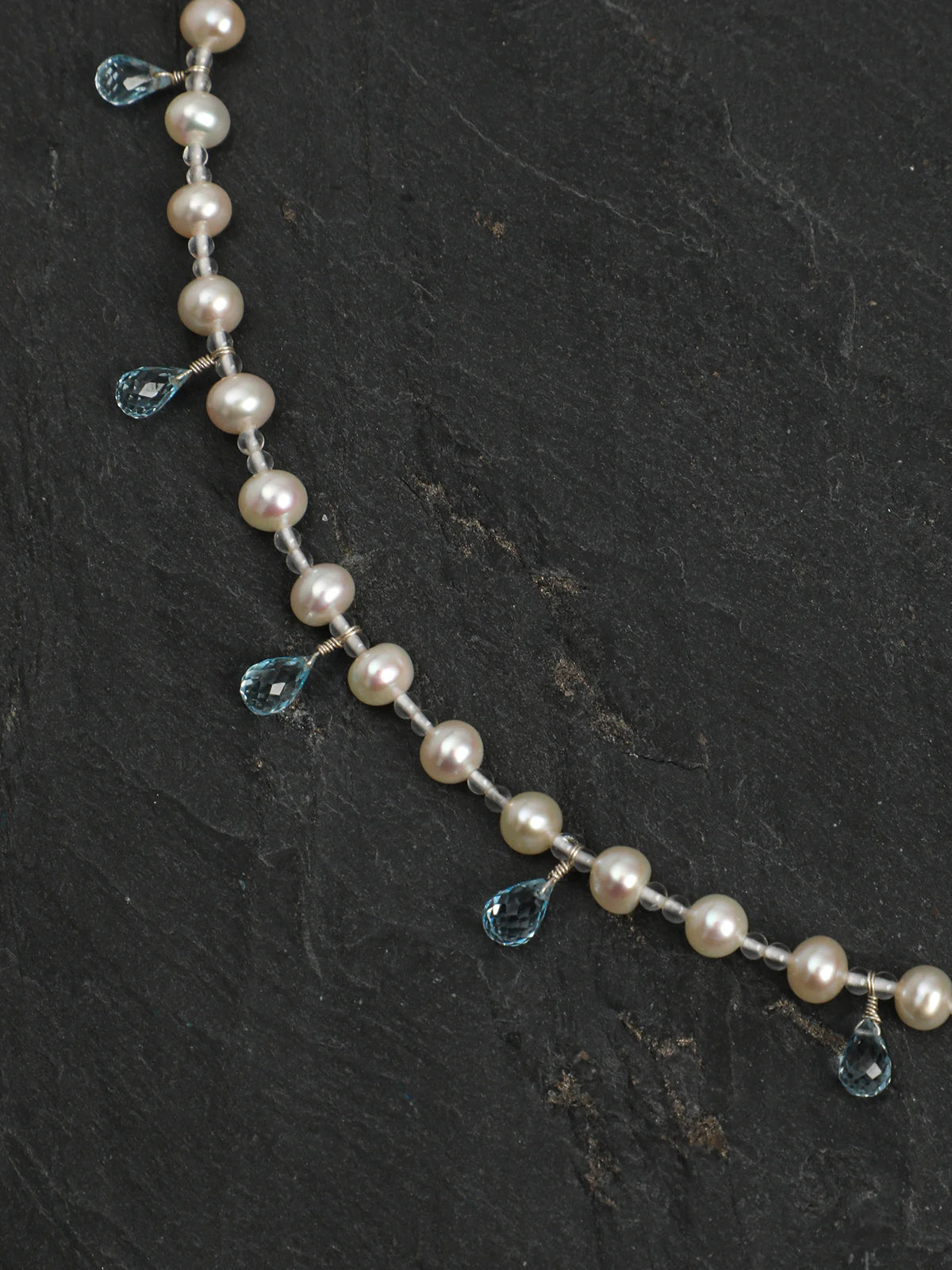 Close-up of the 925 silver hook clasp and engravable silver tag