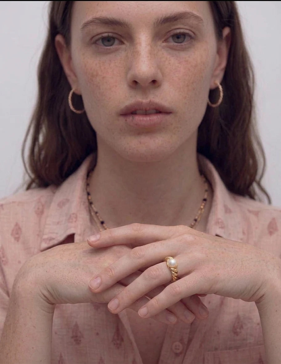 Model wearing the Drift Pearl Beaded Open Ring in gold