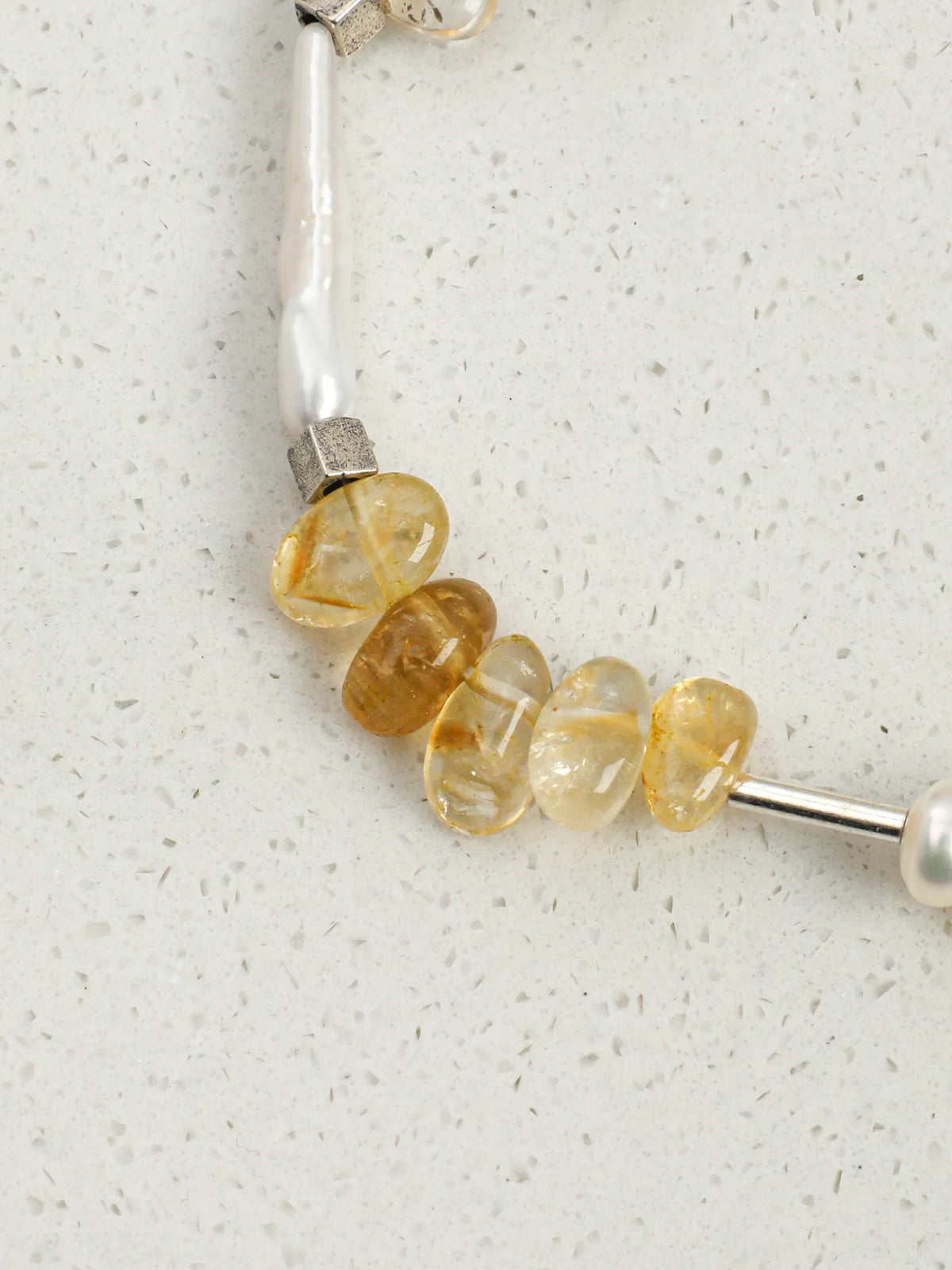 Close-up of the Thai silver cube spacers and engravable silver bar tag