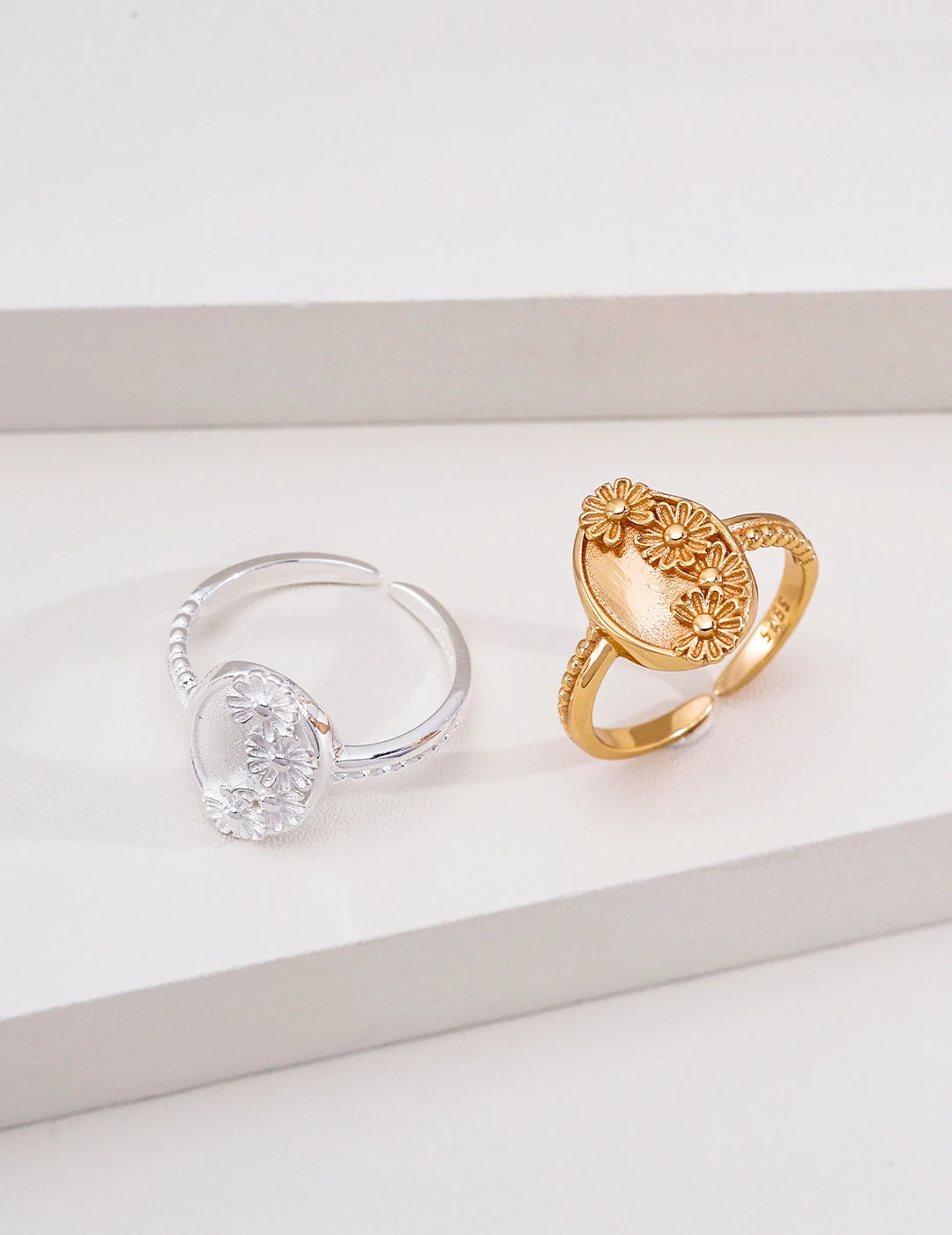 Vintage Daisy Oval Open Ring shown in both silver and gold colorways