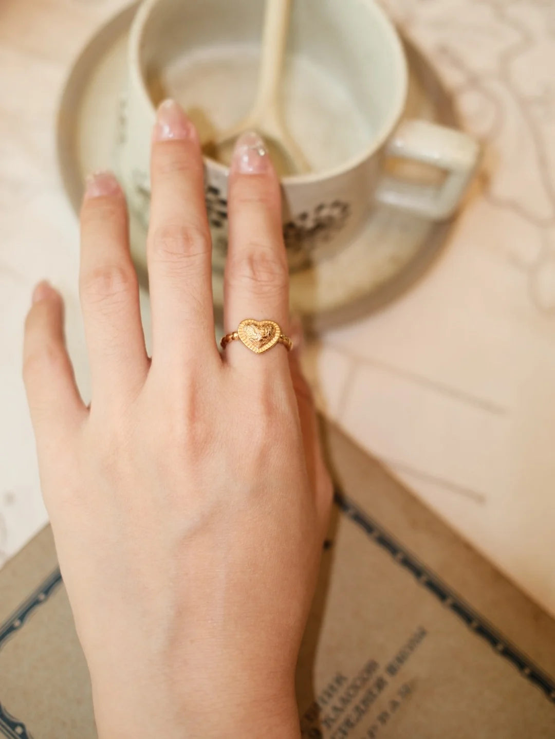 Model wearing the Vintage Textured Heart Open Ring in gold