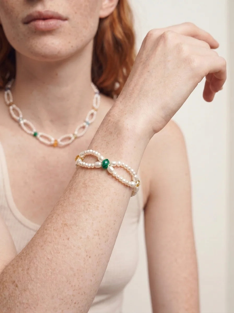 Illustrative styling image of the Woven Waves bracelet worn on the wrist
