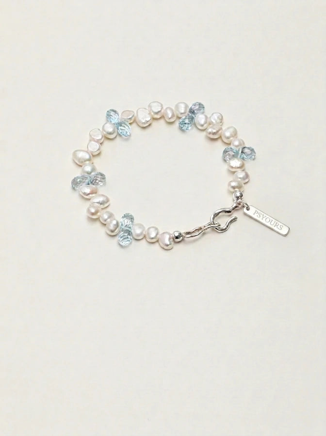 Baroque pearl and blue topaz bracelet with silver clasp and rectangular PSYOURS tag