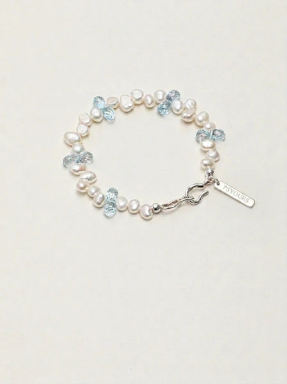 Baroque pearl and blue topaz bracelet with silver clasp and rectangular PSYOURS tag