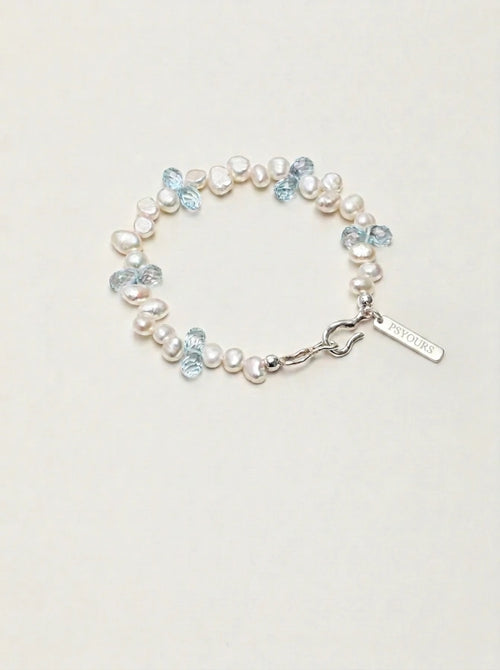 Baroque pearl and blue topaz bracelet with silver clasp and rectangular PSYOURS tag