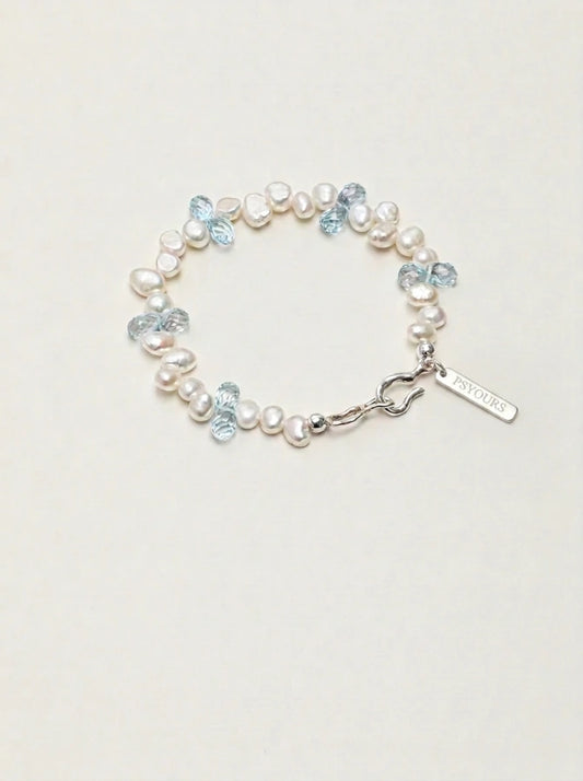 Baroque pearl and blue topaz bracelet with silver clasp and rectangular PSYOURS tag